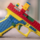 Image for article titled Encrusting a Gun With LEGO Does Not Change Hearts and Minds, but It Does Attract Lawyers